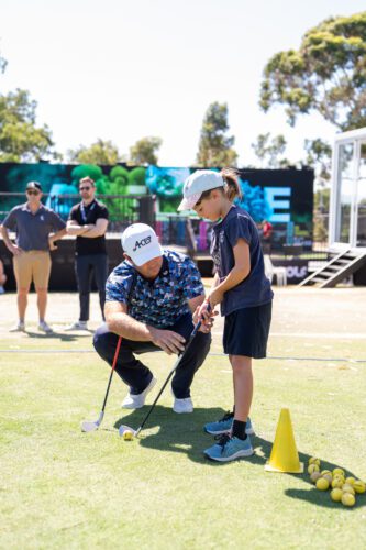 Patrick Reed giving pro tips to GA Junior Program
