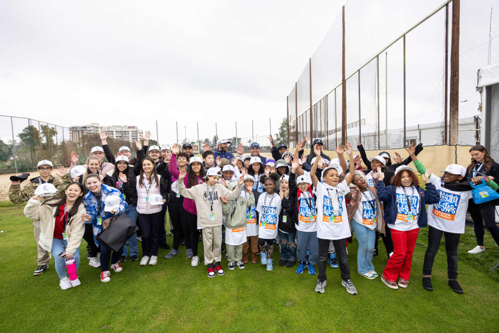 Captain Dustin Johnson of 4Aces GC, Patrick Reed of 4Aces GC, Harold Varner III of 4Aces GC and Pat Perez of 4Aces GC pose with After School All Stars of Greater Las Vegas students during the Potential, Unleashed event with the 4Aces GC at the University of Nevada on Tuesday, February 06, 2024 in Las Vegas, United States. (Photo by Chris Trotman/LIV Golf)